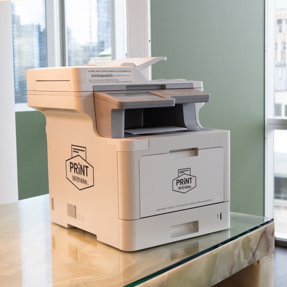 printwithme printer on a table in an apartment building