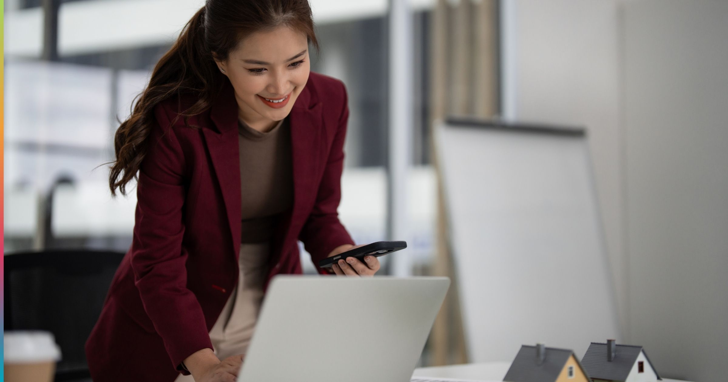 Property manager reviewing data on a laptop, representing AI in multifamily property management and automated operations