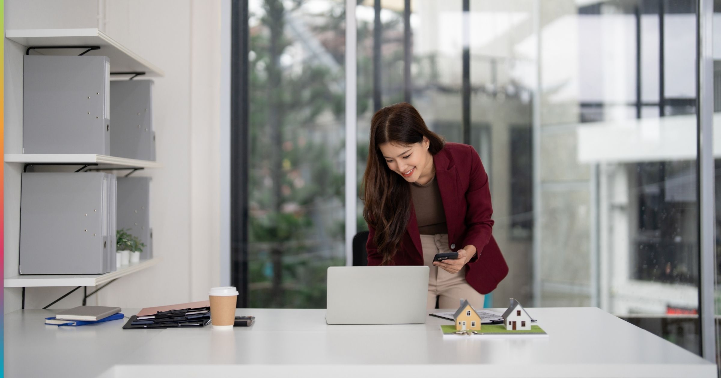 Property manager reviewing centralized systems on a laptop, representing centralization in multifamily property management