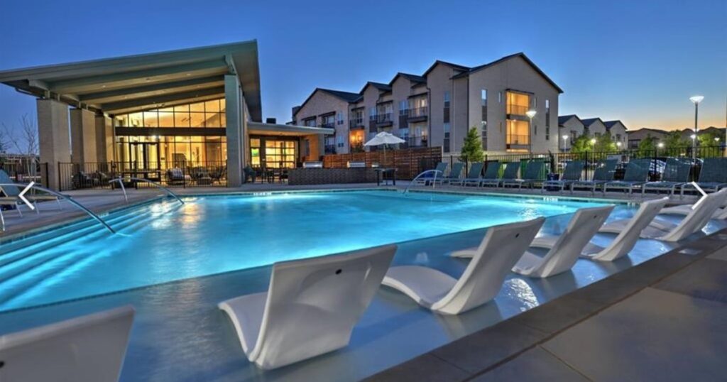 Aspen at Mercer Crossing apartment community pool and clubhouse in Farmers Branch Texas managed by RPM Living