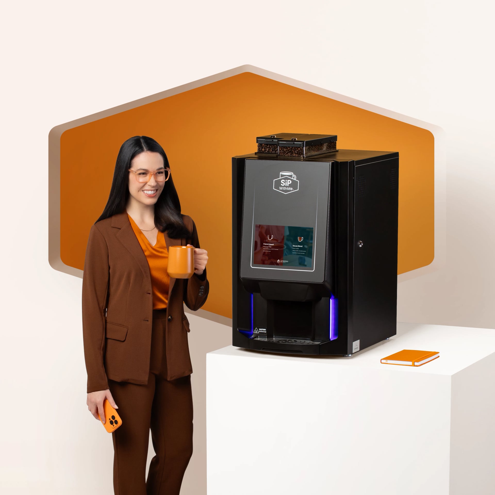 Woman holding coffee beside a SipWithMe bean-to-cup coffee machine