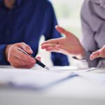 Property manager reviewing a printer contract checklist before signing