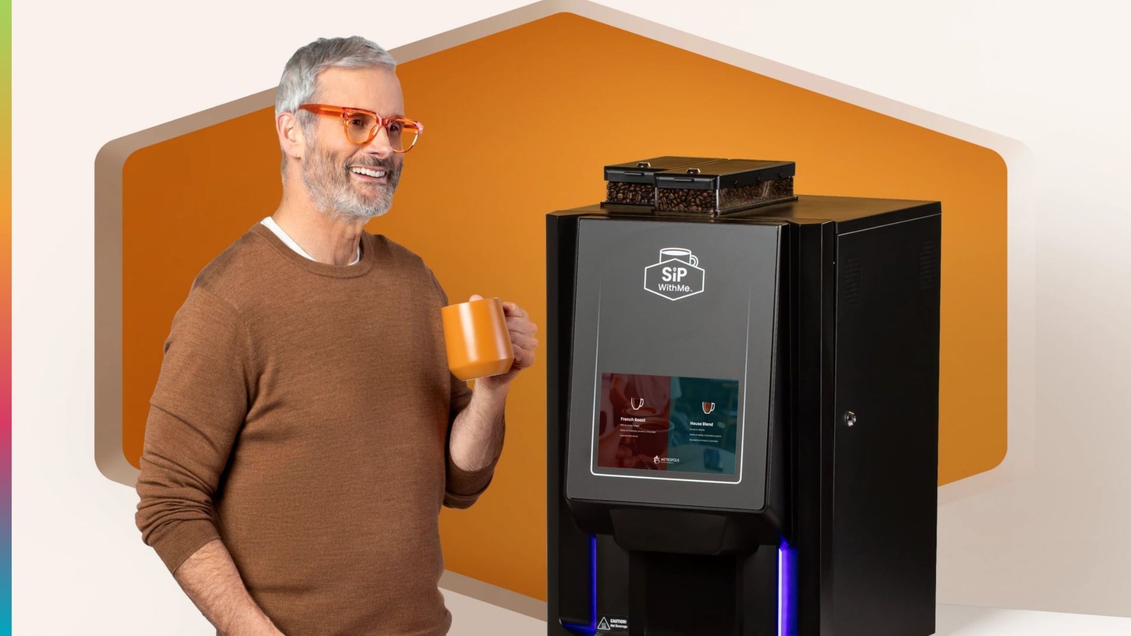 Guest holding a coffee mug beside a SipWithMe commercial coffee machine for hotels.